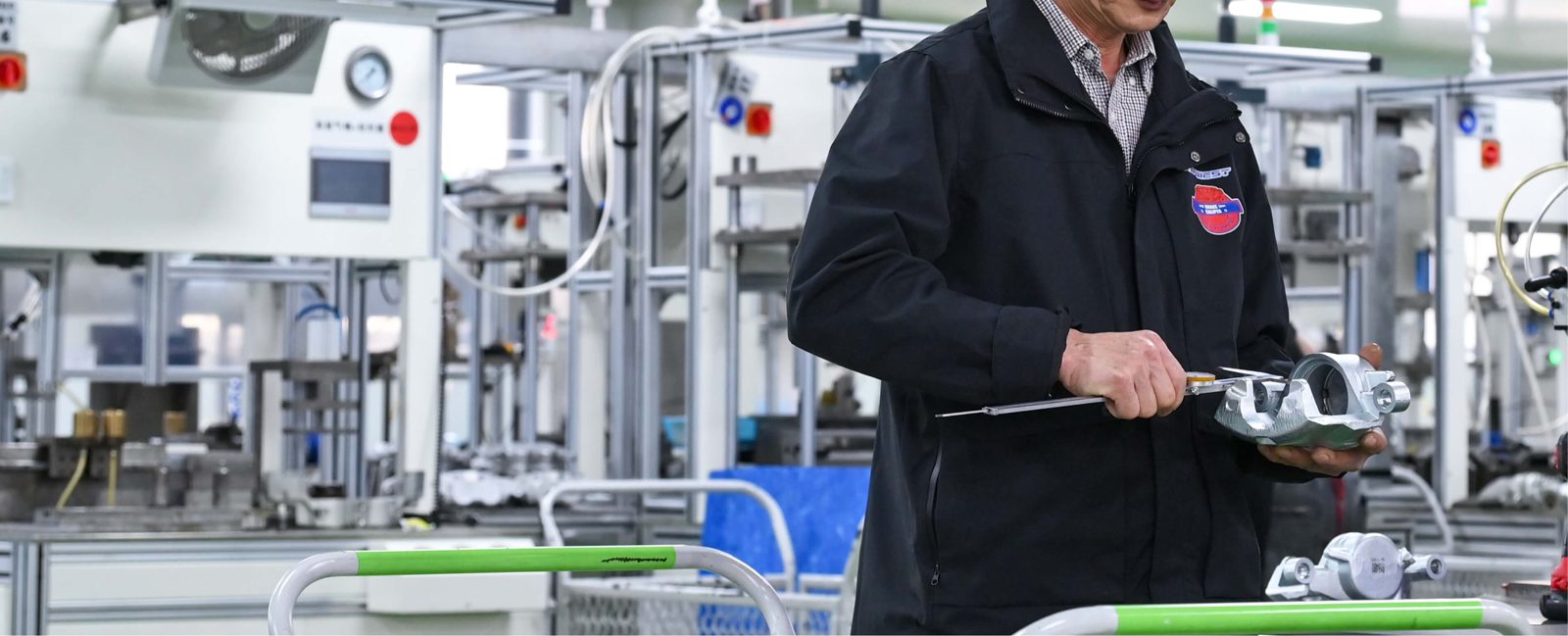 TOPWEST inspector checking brake calipers on the production line